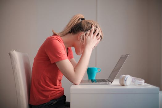 stressed person at a desk