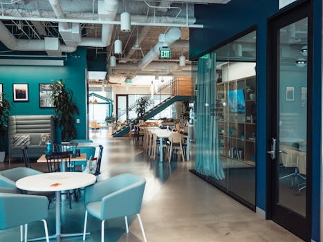 a modern office break area with plants