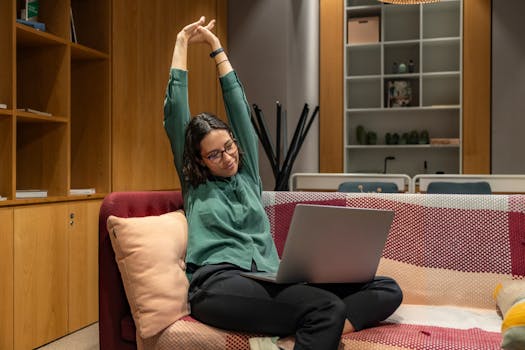 person stretching in office