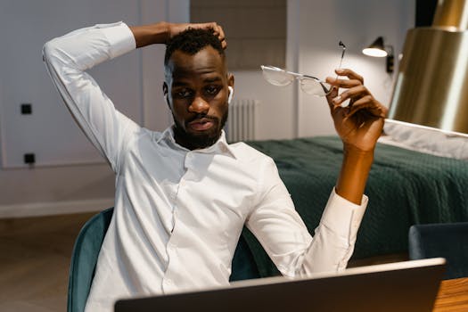 A tired remote worker staring blankly at a computer