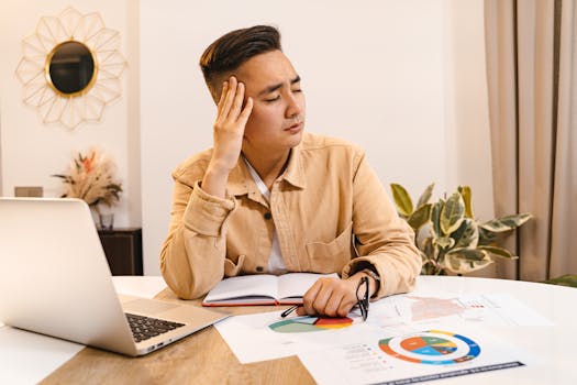 image of a tired entrepreneur at a desk